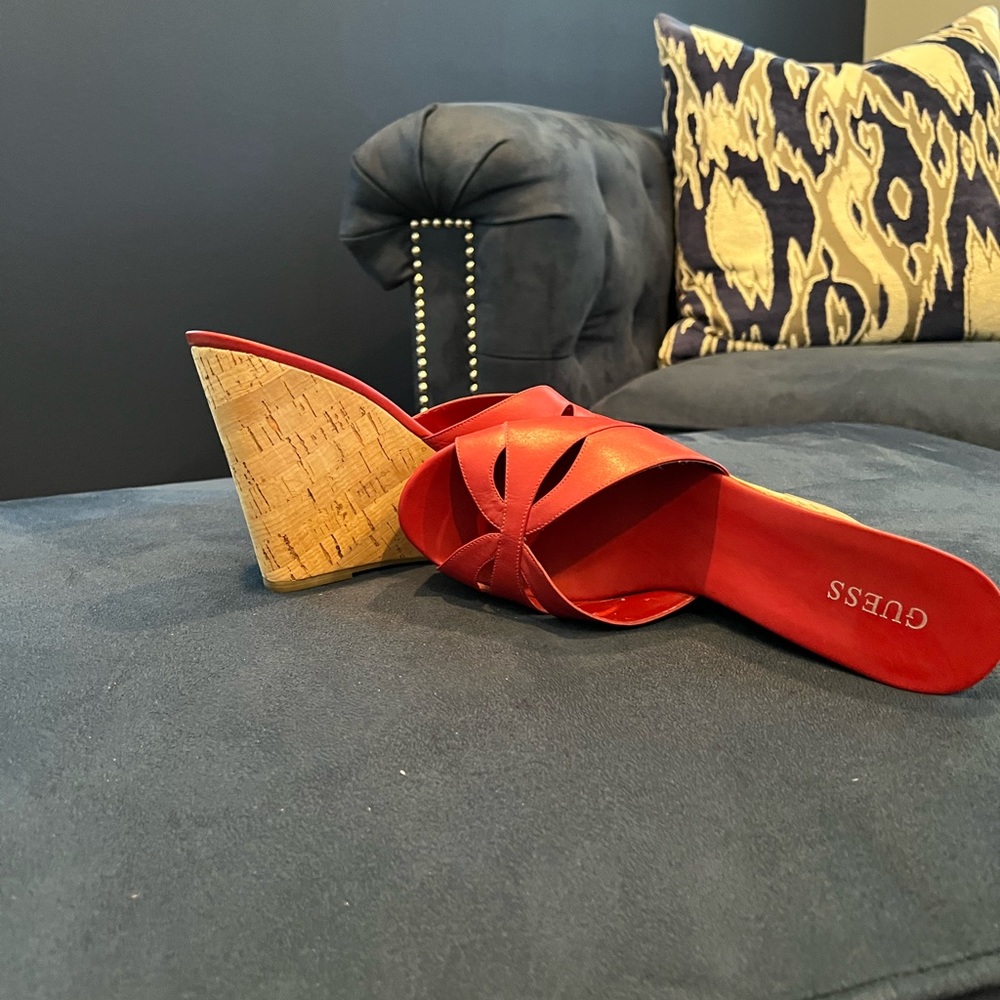 Red wedge heels with a beautiful design on the front. Only wore a few times.